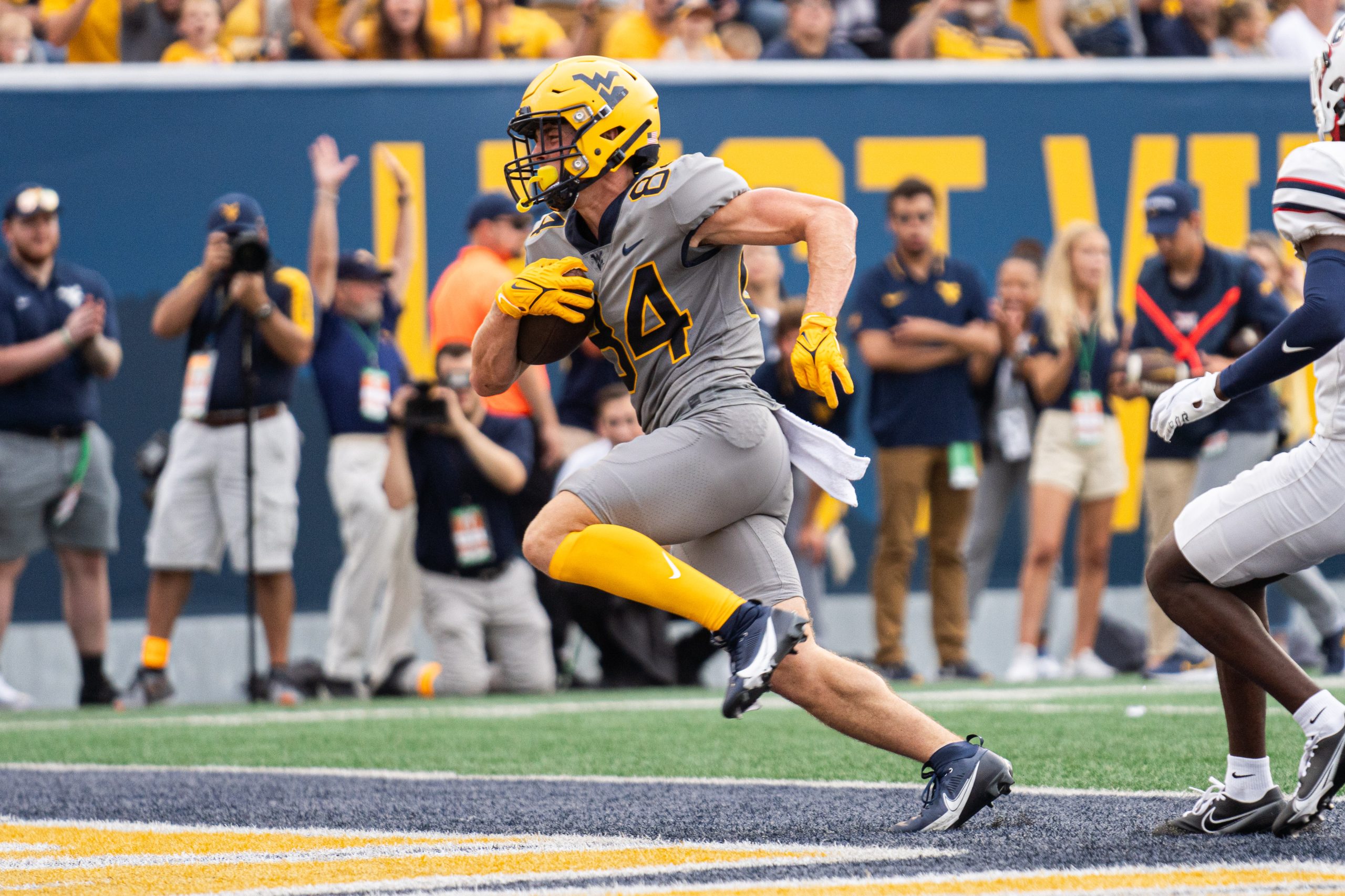 Clement helps WVU top Duquesne 56-17 following extended weather delay
